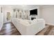 Bright and airy living room with fireplace, TV, and access to the backyard at 2212 Jollay St, Durham, NC 27703