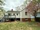 Exterior view of home with deck, lawn, and trees at 2409 Shenandoah Ave, Durham, NC 27704