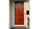 The front door is a wooden door with a glass pane at the top at 2409 Shenandoah Ave, Durham, NC 27704