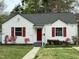 Charming home with red shutters, mature landscaping, and inviting front entrance, perfect for curb appeal at 2409 Shenandoah Ave, Durham, NC 27704