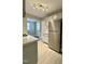 Kitchen with stainless steel refrigerator and bright lights at 2409 Shenandoah Ave, Durham, NC 27704