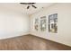 Bright bonus room featuring hardwood floors and many windows at 244 Bevis Marks Dr, Fuquay Varina, NC 27526
