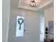 Bright entryway with decorative light fixture and view of front door at 244 Bevis Marks Dr, Fuquay Varina, NC 27526