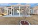 Back of home featuring a screened porch and stone patio covered by a bright, white pergola at 244 Bevis Marks Dr, Fuquay Varina, NC 27526