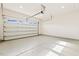 Clean, modern garage with epoxy flooring and an automatic door, providing ample parking space at 244 Bevis Marks Dr, Fuquay Varina, NC 27526