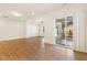Spacious open-concept living room with wood floors and sliding glass doors to the patio at 244 Bevis Marks Dr, Fuquay Varina, NC 27526