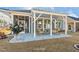 Virtually staged stone patio under a pergola, perfect for enjoying outdoor living and dining at 244 Bevis Marks Dr, Fuquay Varina, NC 27526