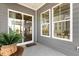 View of covered patio with windows and open door at 244 Bevis Marks Dr, Fuquay Varina, NC 27526