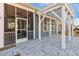 Covered patio with ceiling fan and outdoor entrance at 244 Bevis Marks Dr, Fuquay Varina, NC 27526