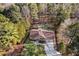 Aerial view of the home with mature trees and a lush landscaped yard at 2520 Summit Ln, Creedmoor, NC 27522
