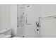 Bathroom features a walk-in shower, grab bars, and a shower seat at 2520 Summit Ln, Creedmoor, NC 27522