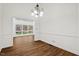 Bright dining room featuring hardwood floors and a modern chandelier at 2520 Summit Ln, Creedmoor, NC 27522