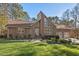 Brick home features a large picture window, beautiful landscaping and a two-car garage at 2520 Summit Ln, Creedmoor, NC 27522