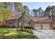 Charming brick home features a large front yard and attached two-car garage at 2520 Summit Ln, Creedmoor, NC 27522
