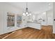 View of a kitchen featuring granite counters, stainless appliances, and access to a screened-in porch at 2520 Summit Ln, Creedmoor, NC 27522