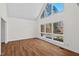 Bright living room featuring large windows, hardwood floors, and natural light at 2520 Summit Ln, Creedmoor, NC 27522