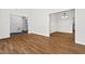 Open-concept living area with hardwood floors and easy access to the dining room at 2520 Summit Ln, Creedmoor, NC 27522