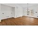 Spacious living room featuring wood floors, neutral walls, and access to a sunroom at 2520 Summit Ln, Creedmoor, NC 27522