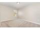 A spacious bedroom with plush carpeting, a large window, and neutral color is bathed in natural light at 2815 E Brookwood Ct, Creedmoor, NC 27522