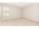 A large bedroom with neutral walls and plush carpeting offers a serene and inviting atmosphere at 2815 E Brookwood Ct, Creedmoor, NC 27522
