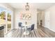 Bright dining area with modern lighting fixture and sliding glass doors for easy access to backyard at 2815 E Brookwood Ct, Creedmoor, NC 27522