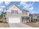 Charming two-story home with a two-car garage and a cozy front porch, set in a friendly neighborhood at 2815 E Brookwood Ct, Creedmoor, NC 27522