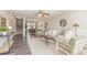 Bright living room featuring stylish furniture, a ceiling fan, and an open view to the dining area at 2815 E Brookwood Ct, Creedmoor, NC 27522