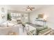 Bright living room featuring stylish furniture, a ceiling fan, and a welcoming entryway at 2815 E Brookwood Ct, Creedmoor, NC 27522
