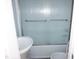 This bathroom has a shower-tub combo with a shower door and a single sink at 2918 Kanewood Dr, Durham, NC 27707