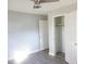 This bedroom offers a ceiling fan, a neutral color, and a closet for storage at 2918 Kanewood Dr, Durham, NC 27707