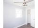 This bedroom features a ceiling fan, a window with natural light, and a closet with a door at 2918 Kanewood Dr, Durham, NC 27707