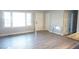 Bright living room with modern flooring, neutral walls, and ample natural light at 2918 Kanewood Dr, Durham, NC 27707