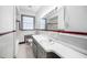 Classic bathroom features a tiled wall and vanity with sink, offering a vintage feel at 3074 Granville Dr, Raleigh, NC 27609