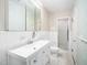 Bright bathroom features a shower and vanity with ample storage space and a mirrored medicine cabinet at 3074 Granville Dr, Raleigh, NC 27609