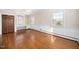 Bright bedroom with hardwood floors, built-in shelving, and multiple windows offering great natural light at 3074 Granville Dr, Raleigh, NC 27609
