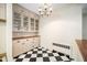 Open dining area features built-in cabinets, hardwood countertop, and chandelier lighting at 3074 Granville Dr, Raleigh, NC 27609