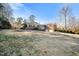 Exterior view of a large brick home with an attached garage and a large yard at 3074 Granville Dr, Raleigh, NC 27609