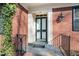 Close-up of the front door showing the house number, decorative details, and brick facade at 3074 Granville Dr, Raleigh, NC 27609