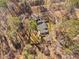 A stunning aerial view of a single-Gathering home with a fenced yard surrounded by lush trees and greenery at 318 Holland Glen St, Fuquay Varina, NC 27526