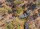 Aerial view of the property showcasing the backyard, trees, and surrounding landscape at 318 Holland Glen St, Fuquay Varina, NC 27526