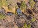 Overhead view of the property featuring the single-Gathering home, and its yard surrounded by lush trees and greenery at 318 Holland Glen St, Fuquay Varina, NC 27526