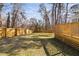 Backyard featuring a spacious wooden deck, providing additional space for recreation at 318 Holland Glen St, Fuquay Varina, NC 27526