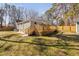 Backyard featuring a spacious wooden deck, steps and lush lawn at 318 Holland Glen St, Fuquay Varina, NC 27526