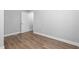 A well-lit room with new hardwood flooring, fresh neutral paint and updated trim at 318 Holland Glen St, Fuquay Varina, NC 27526