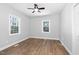 A well-lit room with new hardwood flooring, fresh neutral paint and updated trim at 318 Holland Glen St, Fuquay Varina, NC 27526