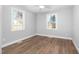 Bedroom showcasing new floors, fresh paint, and natural light at 318 Holland Glen St, Fuquay Varina, NC 27526