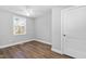 A well-lit room with new hardwood flooring, fresh neutral paint and updated trim at 318 Holland Glen St, Fuquay Varina, NC 27526