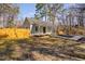 Well-maintained single-story home featuring a tidy lawn, wood fence, and inviting covered front porch at 318 Holland Glen St, Fuquay Varina, NC 27526