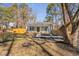 Attractive single-story home featuring fresh landscaping, quaint porch, and a beautifully maintained front yard at 318 Holland Glen St, Fuquay Varina, NC 27526