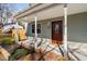 Charming covered front porch with classic columns, updated fixtures, and a tidy walkway to the entrance at 318 Holland Glen St, Fuquay Varina, NC 27526